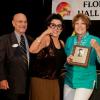 Sisters Ramona Santiago and Shirley Justo accepting award for their father Fighter Chino Alvarez